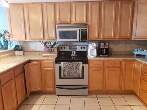 keurig and coffee maker, utensils, microwave, oven