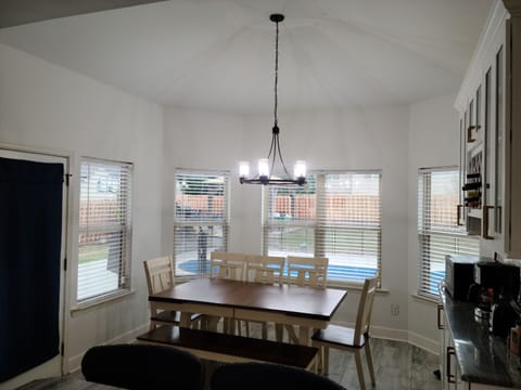 Kitchen eat-in area faces the pool and spa