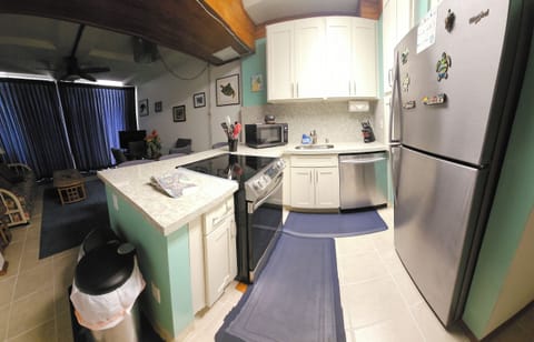 Panoramic view from kitchen into living room.