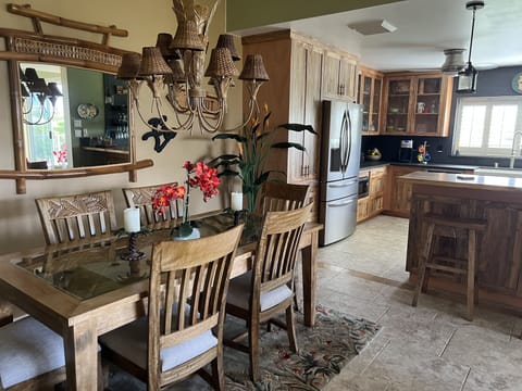 Mango dining room furniture looking into kitchen


