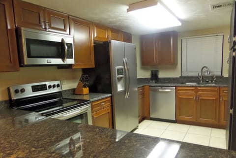 Our newly renovated kitchen with breakfast bar.
