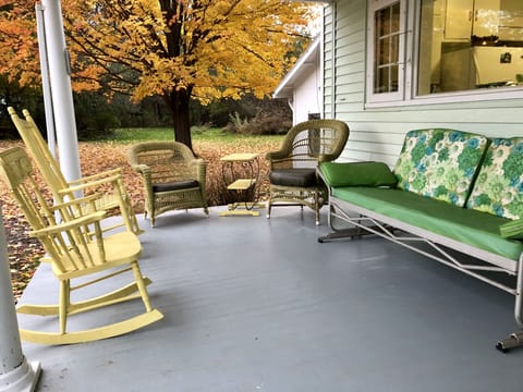 Large, private side porch overlooking side yard. Very cozy and relaxing!