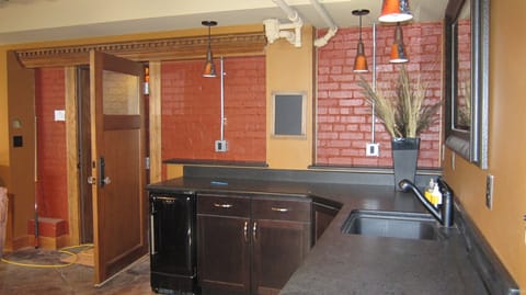 The communal lounge in the basement with also a toilet.