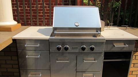 Communal patio outside, propane Viking grill for BBQing.