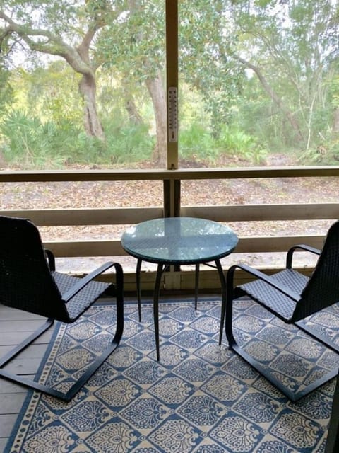 Outdoor screened patio runs along the length of the condo