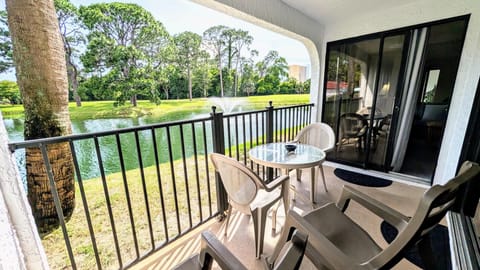 Covered patio with serene pond fountain views