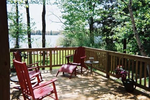Beautiful deck overlooking patio, beach, and lake