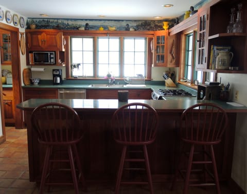 Kitchen with all updated appliances (2015) ,eating counter and panoramic views.