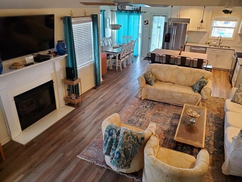 View into house open floor plan with living room, dining room, kitchen w back Dr