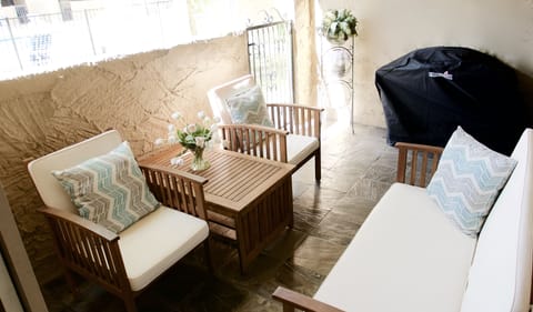 Patio overlooking pool, tennis courts and mountains