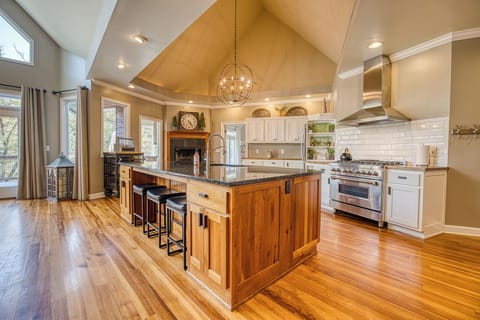 Cook like a pro in our spacious kitchen featuring a professional gas stove, large refrigerator, and a backup fridge in the garage—ideal for hosting and preparing meals for a crowd!