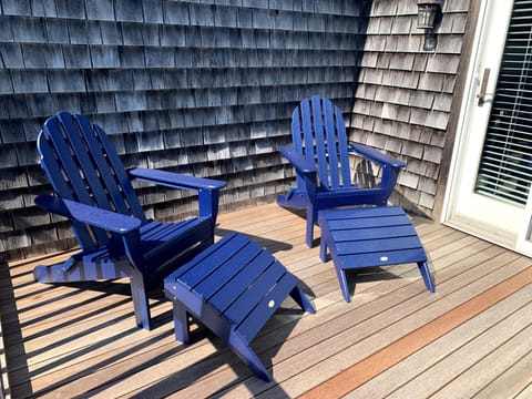 Private upstairs deck off primary suite 2, overlooks backyard with SW sun