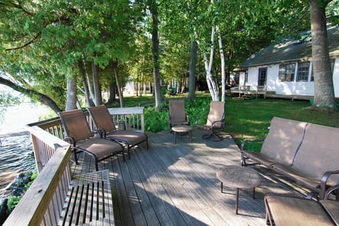 Spacious lakefront deck with plenty of seating for relaxing and gathering