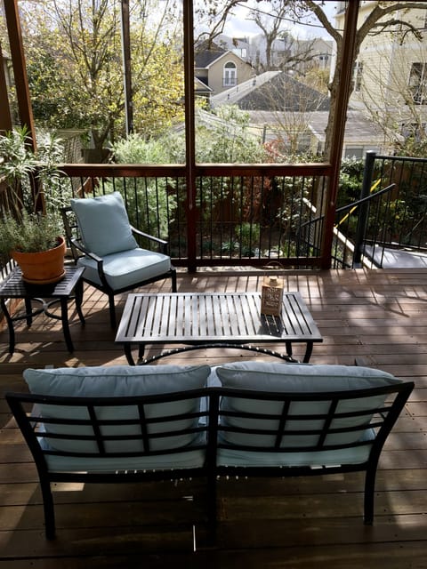 Outdoor seating with view of yard and trees