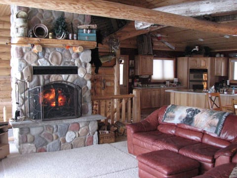 Spacious living room with wood burning fireplace