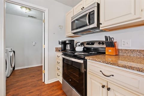 Entrance way into the laundry room and pantry from the kitchen.