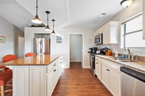 Kitchen island.   All stainless steel applicances.