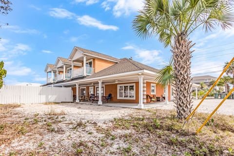 View of home with 3 balconies, private saltwater pool and 1 of 2 parking areas.