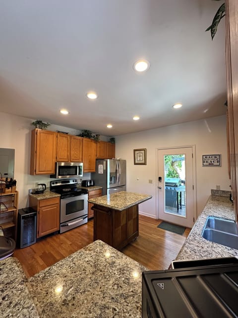 Kitchen with granite countertops and all appliances.