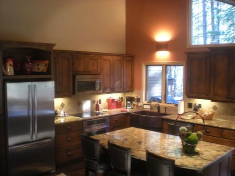 New kitchen with  new appliances, granite, island, windows, doors & wood floors.