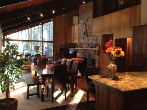 View from kitchen looking out at the golf course and 15th green. Dinning for 12 