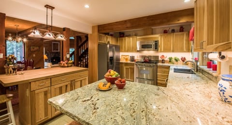 Kitchen opens to DR and Great Room with bar stools for group meal prep & convo