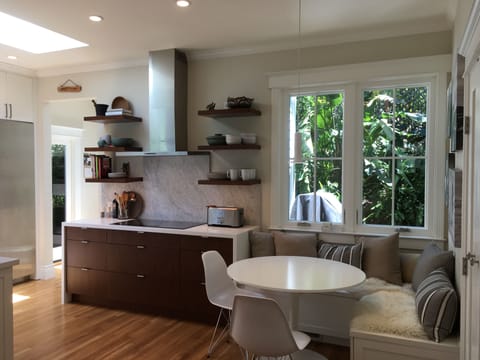 Gourmet kitchen with cozy eat-in nook, perfect for family meals