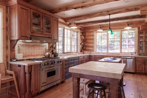 Wolf commercial range and two kitchen islands