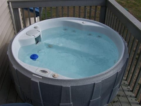 Enjoy the sunset from the soothing hot tub after a day at the beach