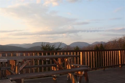 The deck- enjoy dining at tables or sitting on Adirondack chairs great view