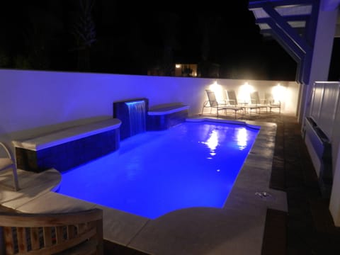 24ft saline pool with courtyard privacy and LED lighting.