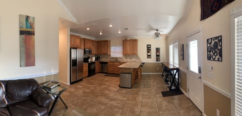 Open floor plan. Kitchen with stainless appliances and granite counter tops.
