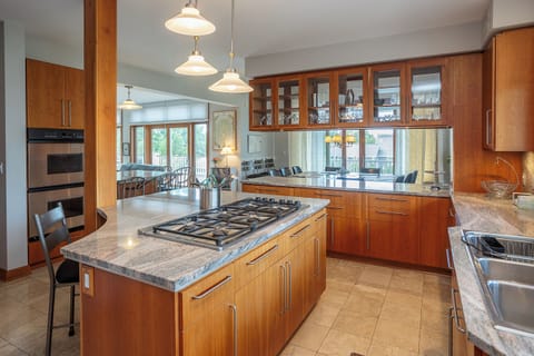 Kitchen view toward screened porch