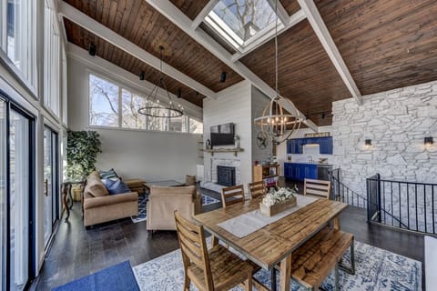 Sloped ceiling to Great room w/ skylight to dining  opens to the kitchen 