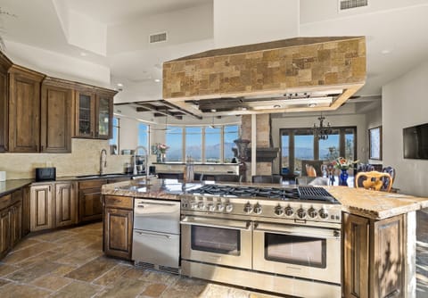 Chef's kitchen with Bluestar gas range and undercounter refrigerator 