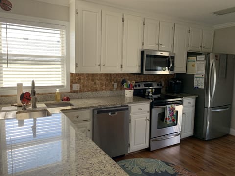 Kitchen w/granite countertops, stainless appliances, refinished cabinets