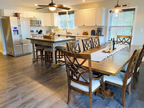 Main level open floor plan with kitchen, living room, dining room