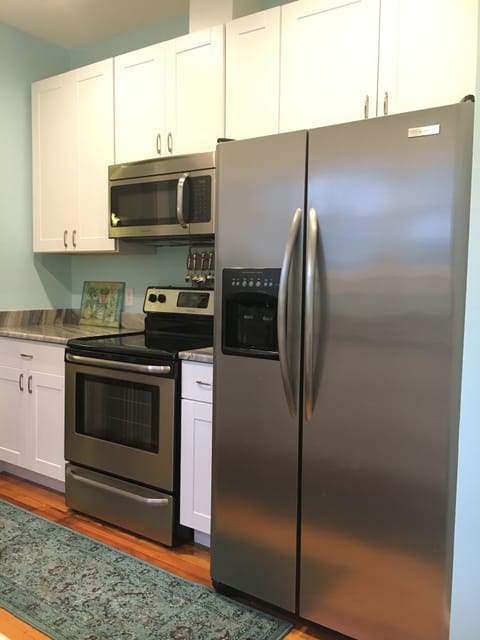 Side by side refrigerator has ice maker