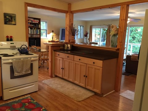 A kitchen stocked for a foodie with a view of the lake as you cook