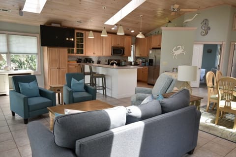 Open and airy living area.  Vaulted ceiling with skylights provides great light.
