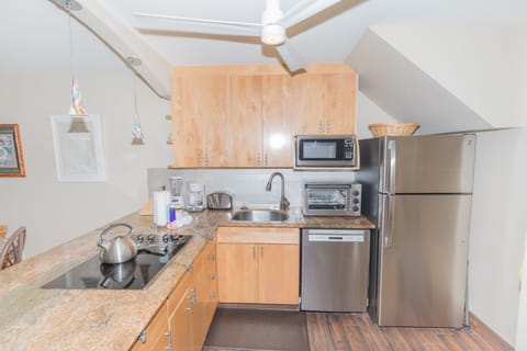 Remodeled kitchen has stainless steel appliances .and granite countertops