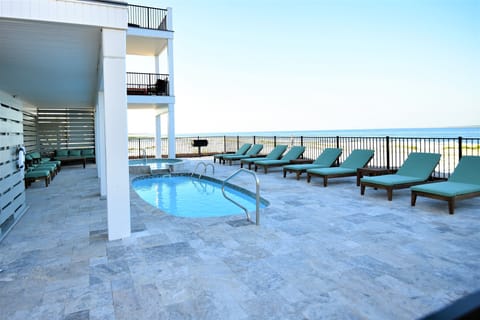 GULF FRONT LOUNGING SPILL OVER & POOL - LARGE TRAVERTINE DECK & SEATING GROUPS