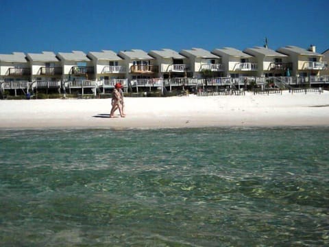 WALK ALONG THE BEACH AND RIGHT UP TO YOUR PRIVATE YARD/DECK TO YOUR TWO LEVEL VILLA