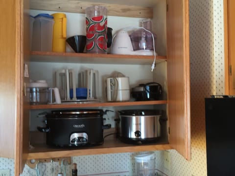Kitchen is stocked for a crowd-crock pots,  blender, fd processor service for 10