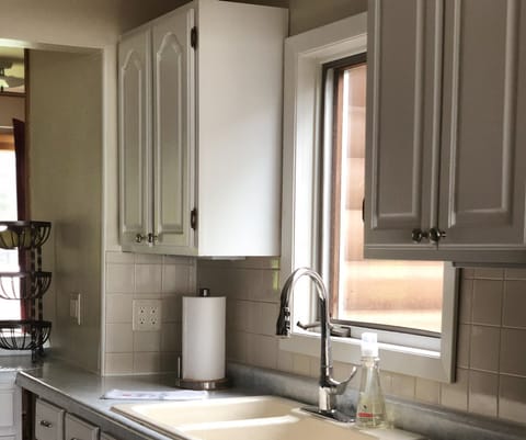 The kitchen leads into the living room with a lake view.
