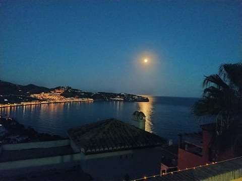 Moon rising over La Herradura Bay