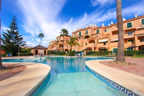exterior - apartment overlooking main pool area and golf course beyond