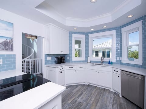 Induction Cooktop, Two Ovens, Quartz Countertops, Stainless Appliances