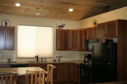 The spacious kitchen has everthing needed to prepare a meal.