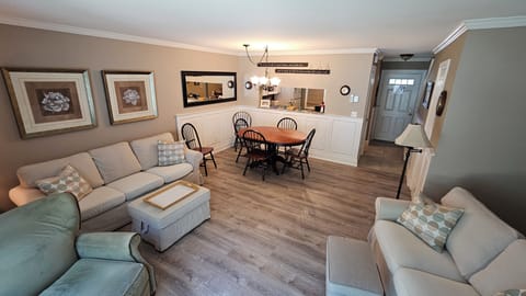 Family room and dining area - repainted and vinyl plank flooring (new in 2025).